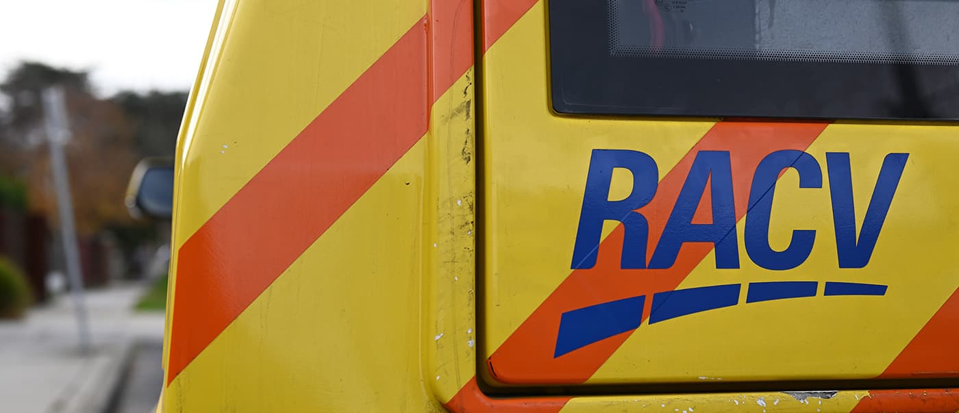 Close up of the logo on the rear of an RACV roadside assistance vehicle, parked in a suburban street in metropolitan Melbourne Close up of the logo on the rear of an RACV roadside assistance vehicle, parked in a suburban street in metropolitan Melbourne