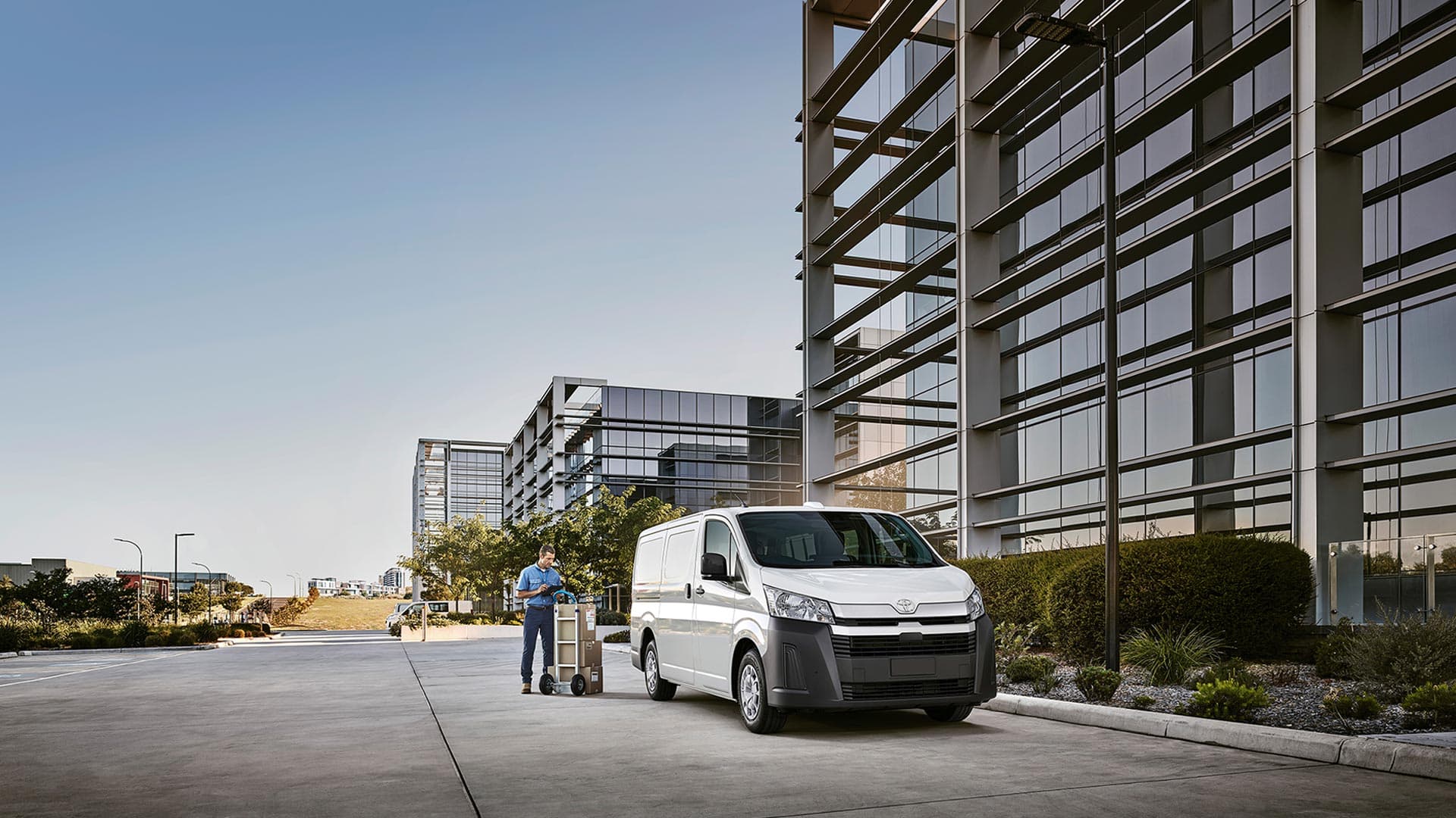 A small business owner unloading a van. A small business owner unloading a van.